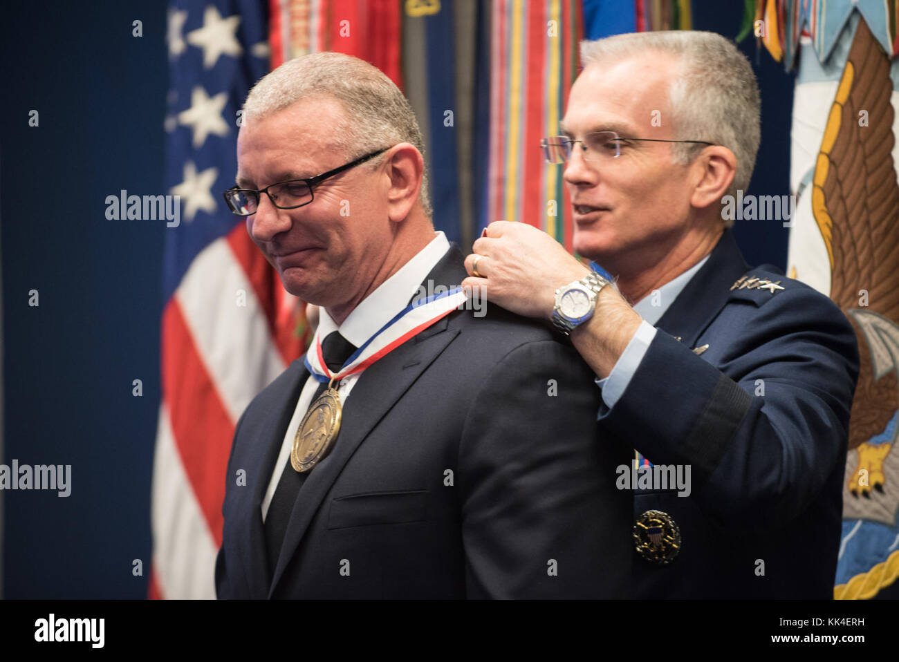 U.S. Air Force Gen. Paul J. Selva, Vice Chairman of the Joint Chiefs of Staff, places the award on Chef Robert Irvine, the Office of the Secretary of Defense Awardee, during the 2017 Spirit of Hope Awards at the Hall of Heroes in the Pentagon, Oct. 26, 2017. The Spirit of Hope Award is awarded to men and women of the U.S. Armed Forces, entertainers, and other distinguished Americans and organizations whose patriotism and service reflect that of Mr. Bob Hope. The recipients selflessly contributed an extraordinary amount of time, talent, or resources to significantly enhance the quality of life  Stock Photo