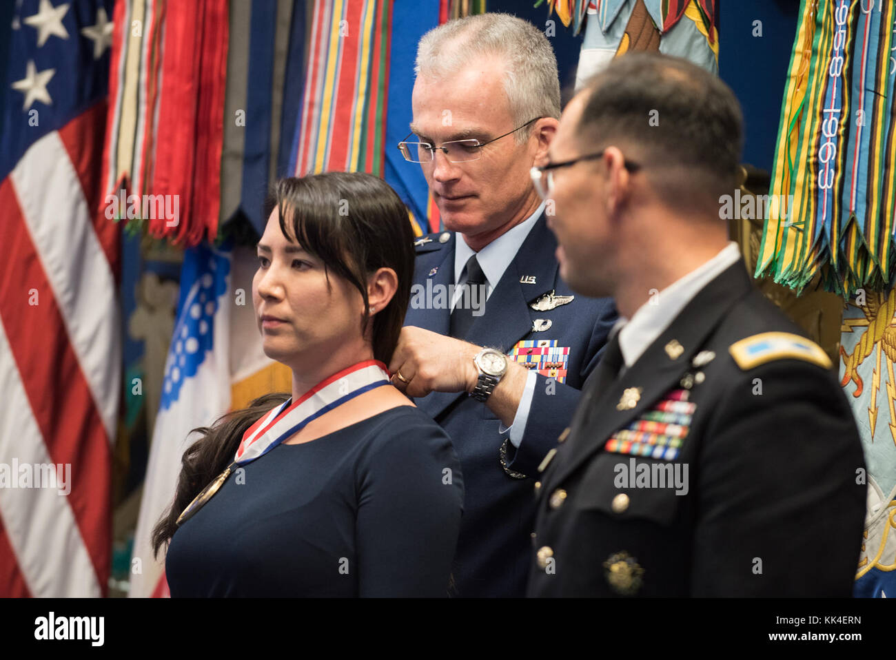 U.S. Air Force Gen. Paul J. Selva, Vice Chairman of the Joint Chiefs of Staff, places the award on Jennifer Correia, the U.S. Army Awardee, during the 2017 Spirit of Hope Awards at the Hall of Heroes in the Pentagon, Oct. 26, 2017. The Spirit of Hope Award is awarded to men and women of the U.S. Armed Forces, entertainers, and other distinguished Americans and organizations whose patriotism and service reflect that of Mr. Bob Hope. The recipients selflessly contributed an extraordinary amount of time, talent, or resources to significantly enhance the quality of life or service members and thei Stock Photo