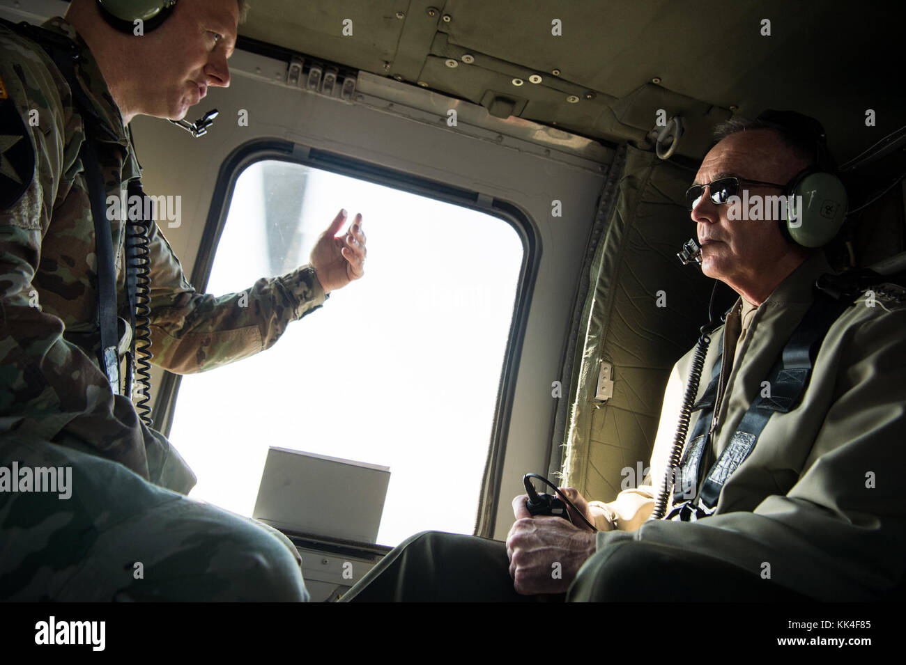 Marine Corps Gen. Joseph F. Dunford Jr., chairman of the Joint Chiefs of Staff, speaks with Army Command Sgt. Maj. John W. Troxell, senior enlisted advisor to the chairman of the Joint Chiefs of Staff, during a helo ride aboard an MH-60 Blackhawk above Seoul, Republic of Korea, Oct. 28, 2017. (DOD photo by Navy Petty Officer 1st Class Dominique A. Pineiro) Stock Photo