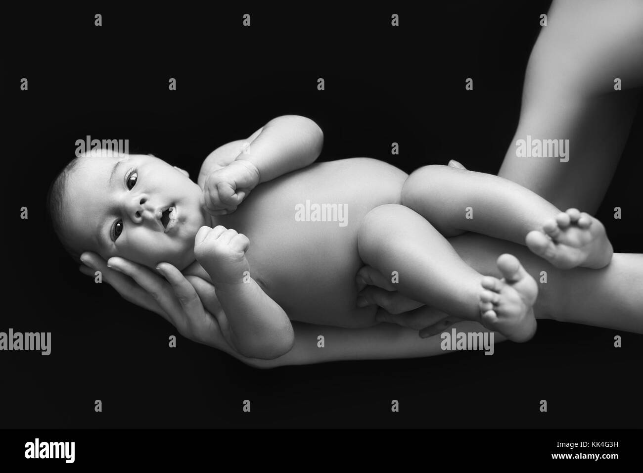 black and white photo of newborn baby Stock Photo