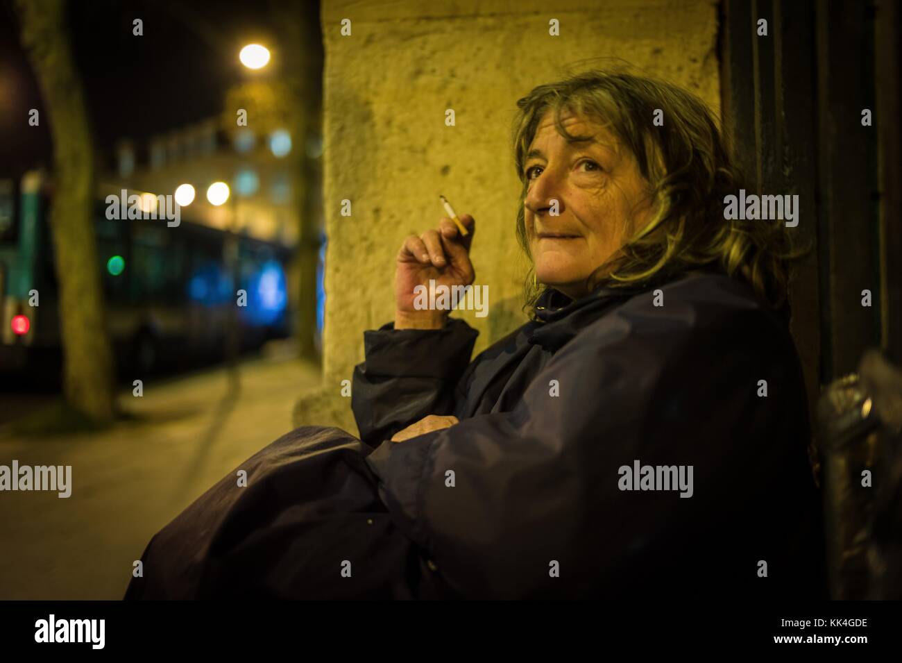 Merde in france -  05/03/2013  -  France / Ile-de-France (region) / Paris  -  Christine the Mexican in the poncho which spends for two years her nights and days sat on the edge of the fence vof the garden of the plants of Paris. She is for seven years in the street.   -  Sylvain Leser / Le Pictorium Stock Photo