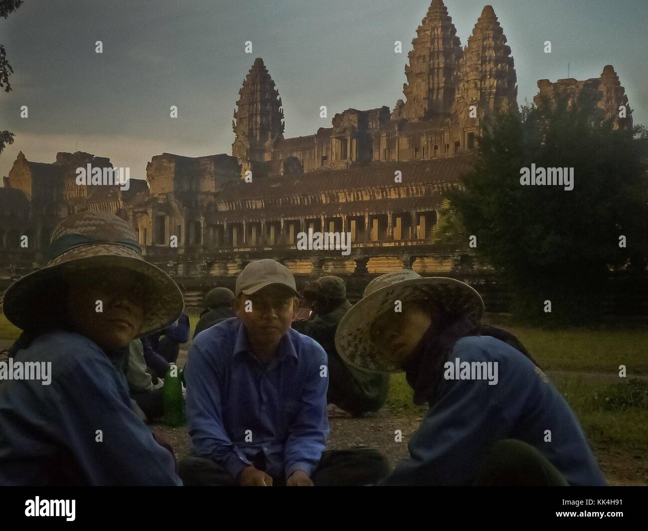 Angkor Wat. -  11/12/2009  -  Cambodia / Angkor  -  Angkor Wat. -  The gardeners, responsible for the maintenance of the temple complex are having a fast and small breakfast before to work.   -  Sylvain Leser / Le Pictorium Stock Photo