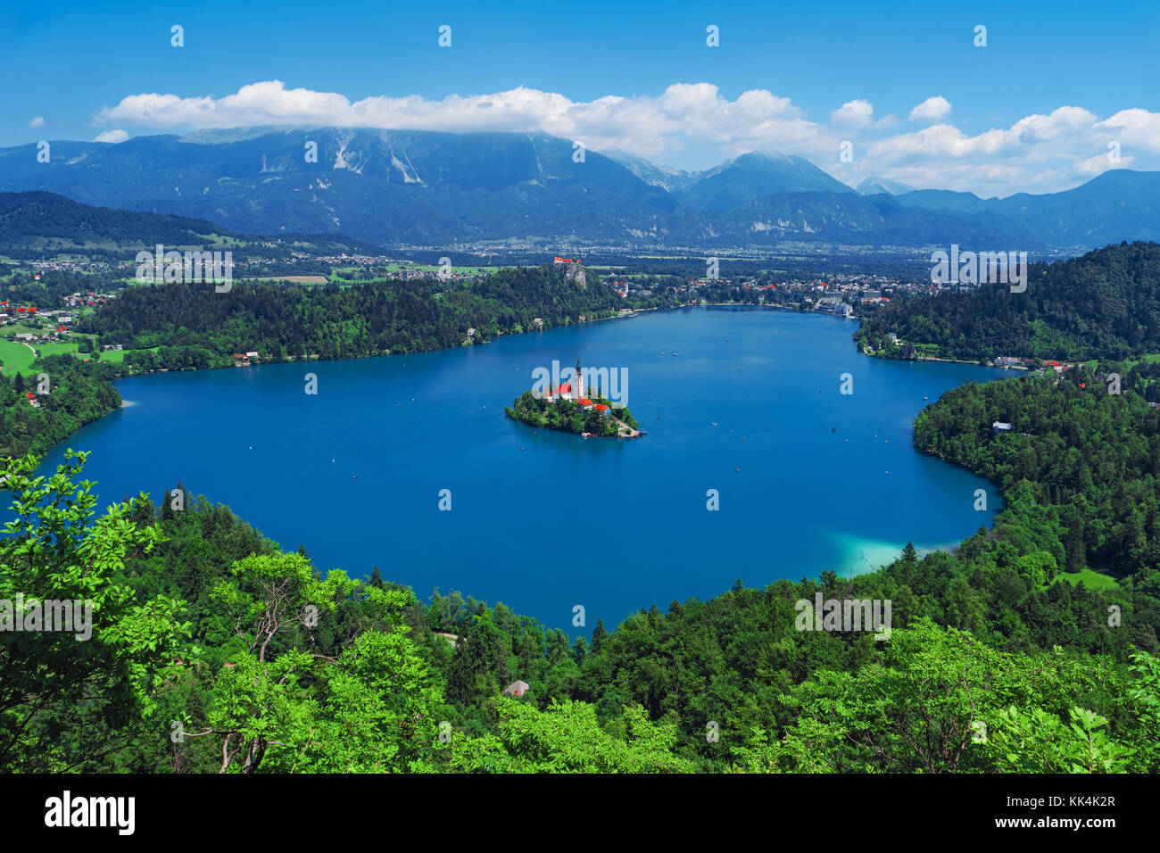 Aerial view of Lake Bled, Alps, Slovenia, Europe. Mountain alpine lake. Island with church in Lake Bled. Summer landscape. Castle and mountains in bac Stock Photo