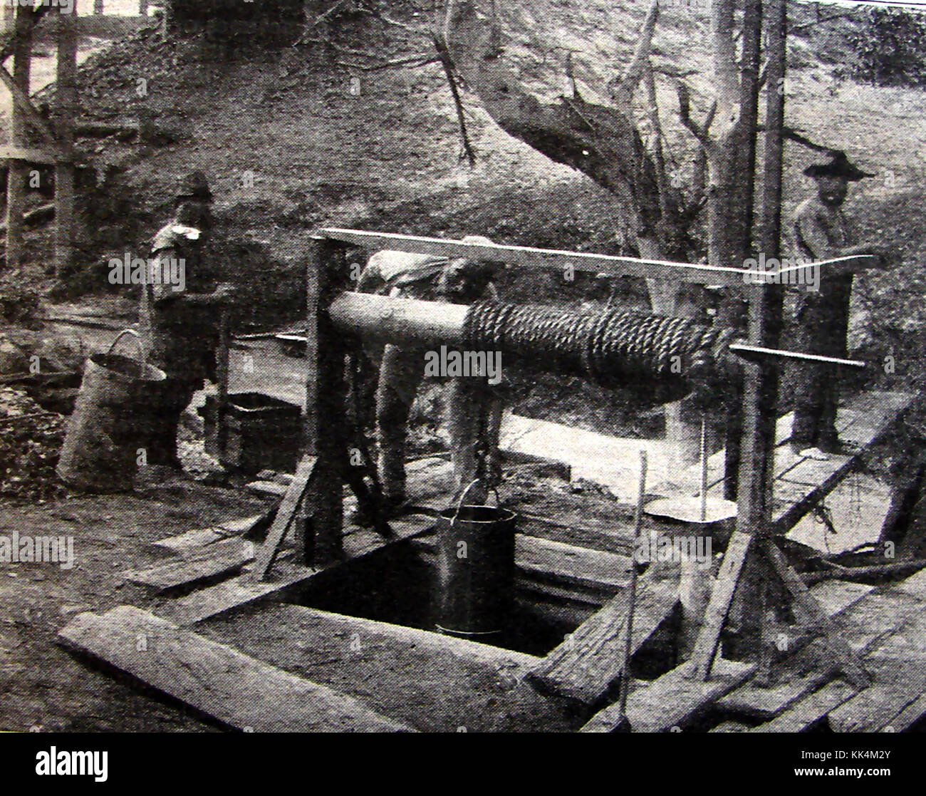 An Australian gold miners  at their pit shaft  and winding gear circa 1906 . Possibly at Tarnagulla, Victoria during the 'Poseidon rush' Stock Photo