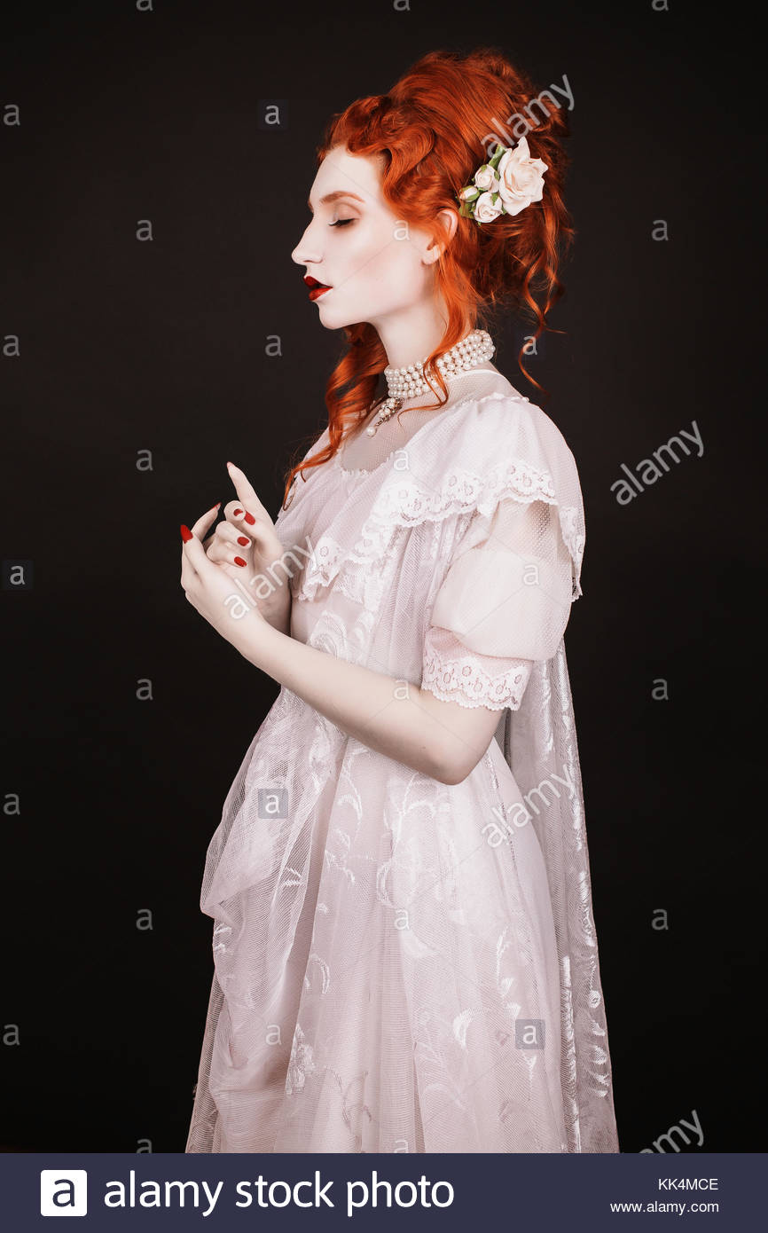 Red Haired Woman In White Dress With Pale Skin On A Black