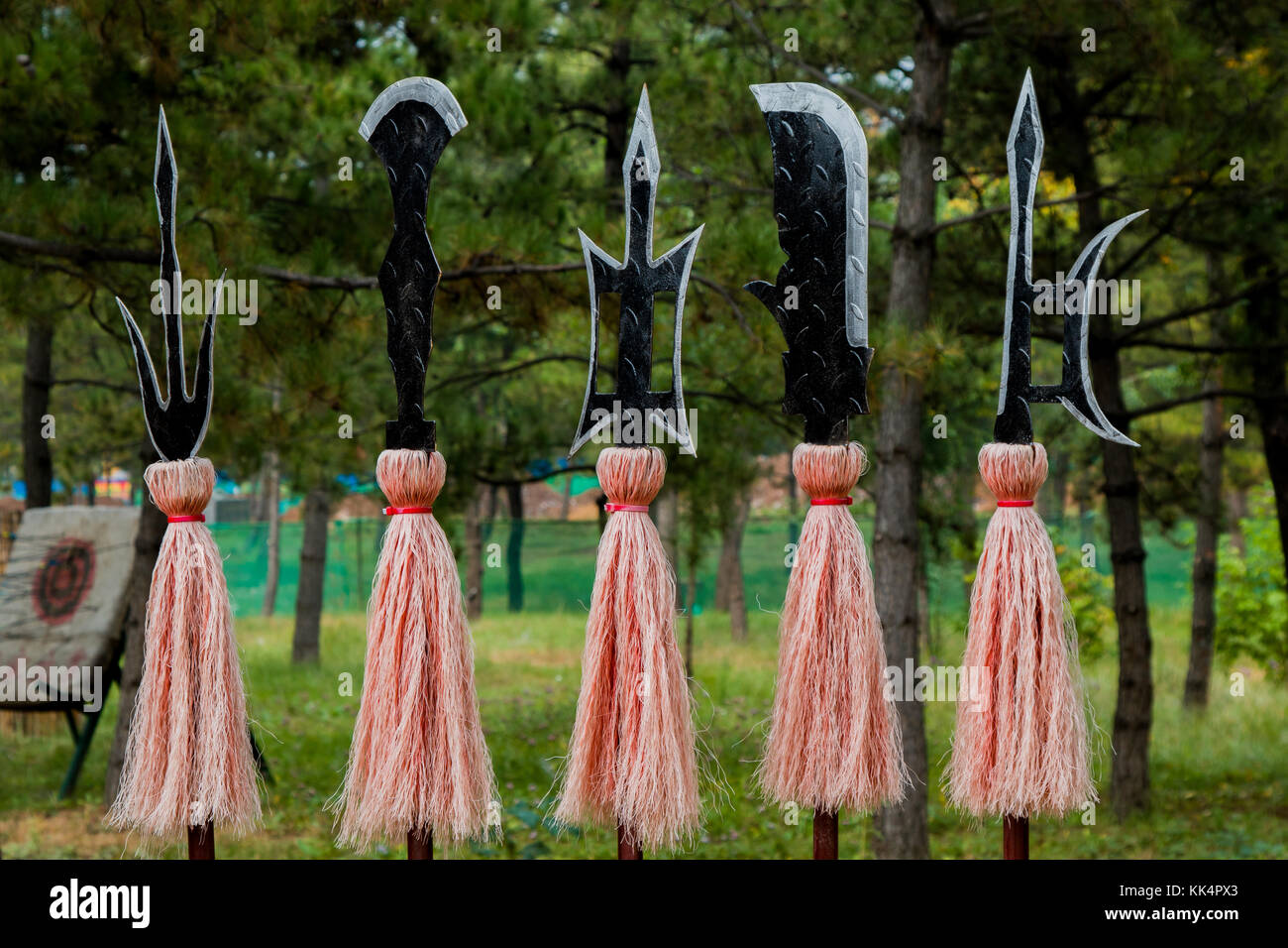 Close up of ancient asian weapons displayed on a weapons rack in the