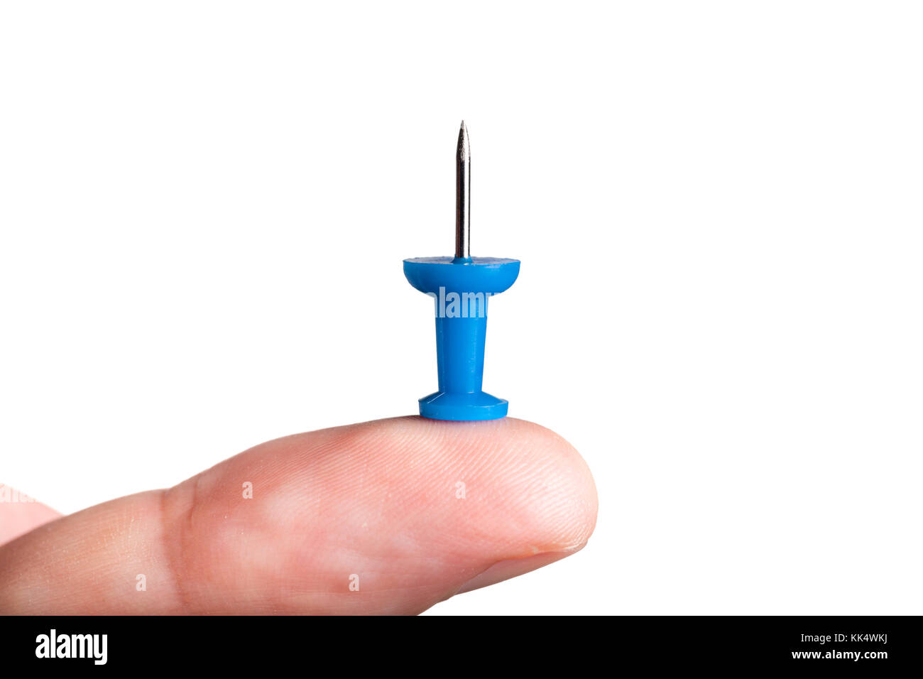 Finger holding push pin Stock Photo Alamy