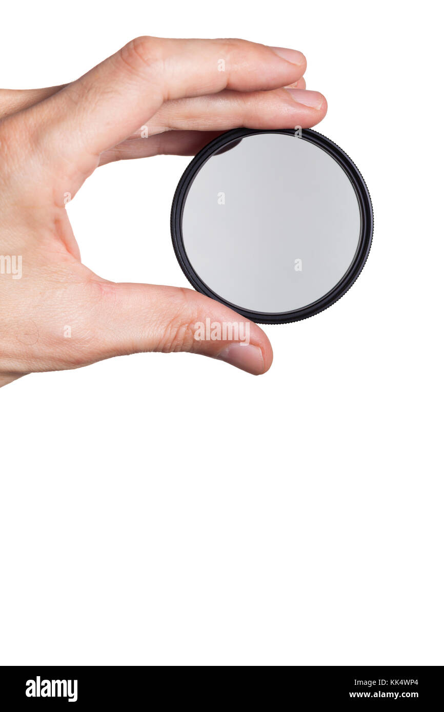 Hand holding a circular polarizing filter Stock Photo