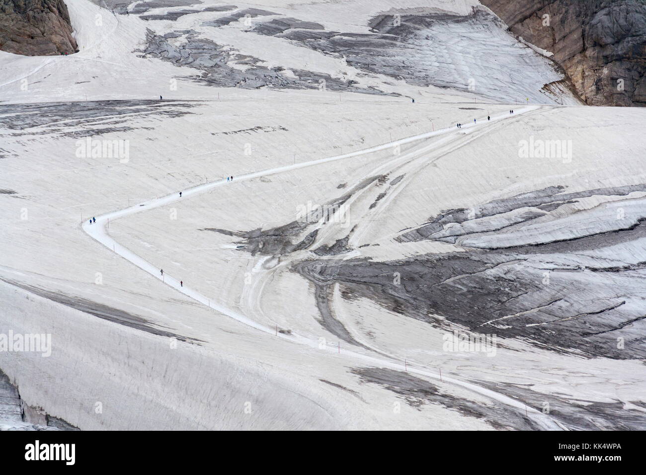 People hiking on Dachstein glacier near Hunerkogel station, Austrian ...