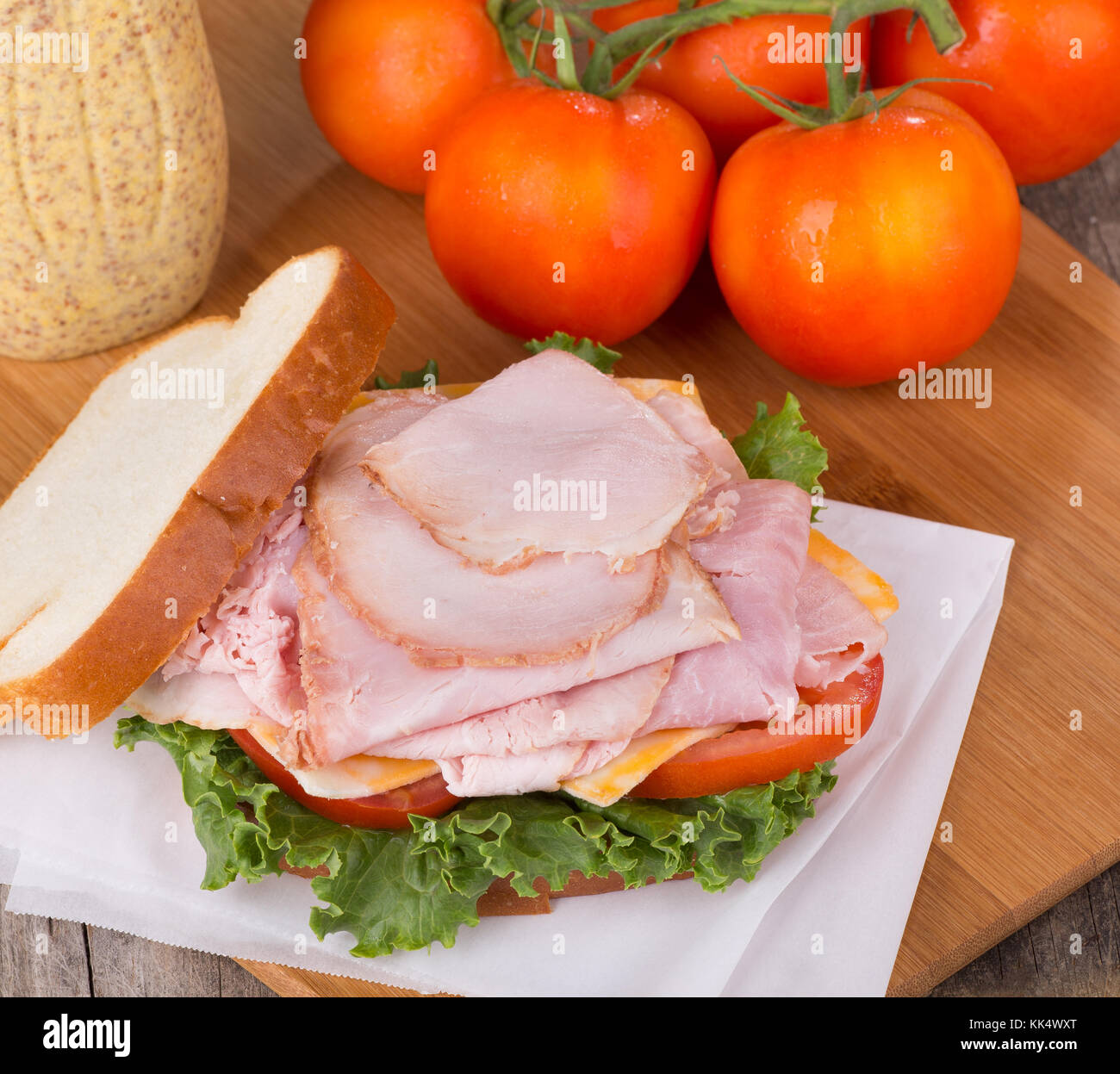 Delicious ham sandwich with lettuce, tomato and cheese Stock Photo Alamy