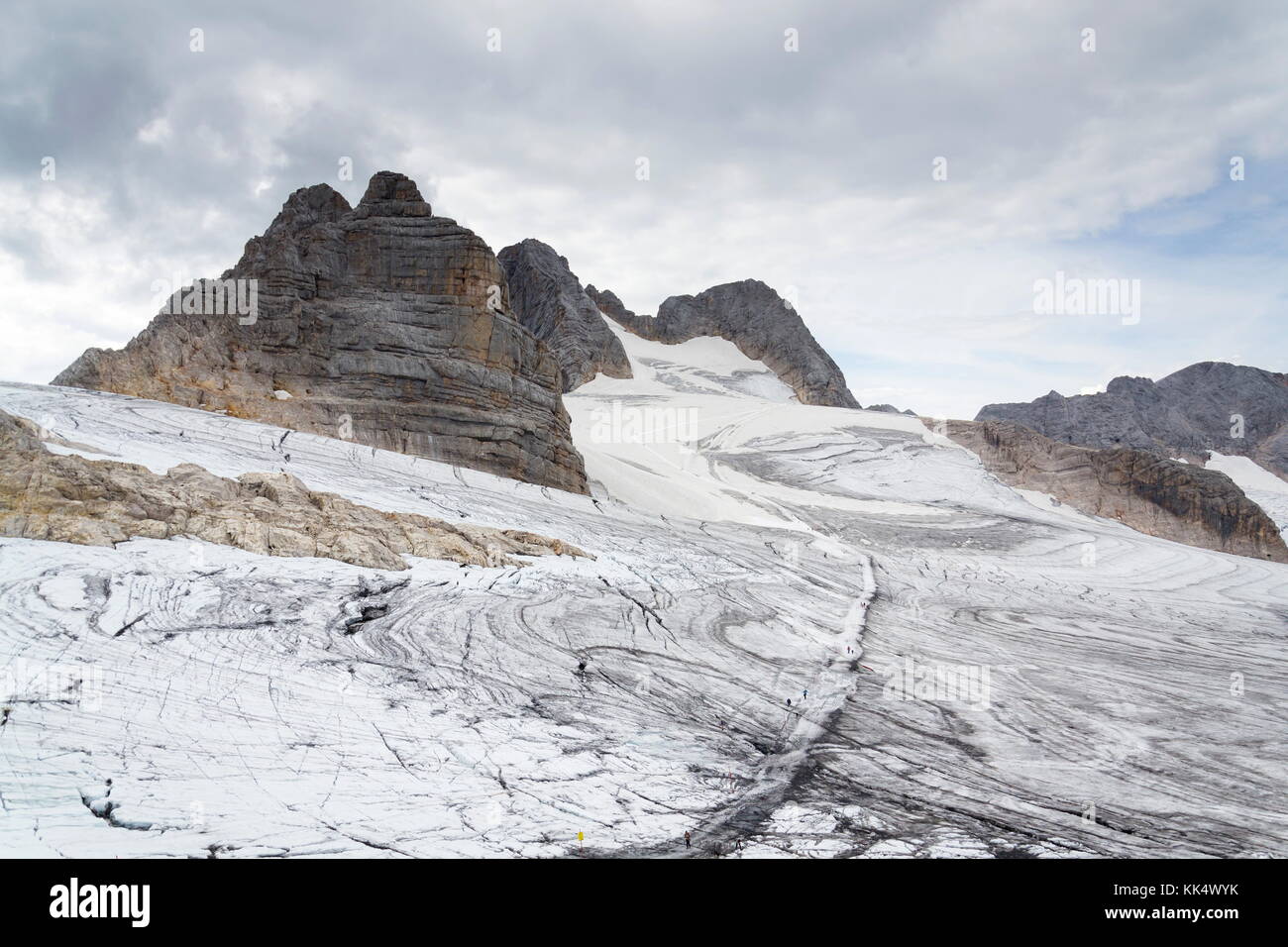 People hiking on Dachstein glacier near Hunerkogel station, Austrian ...