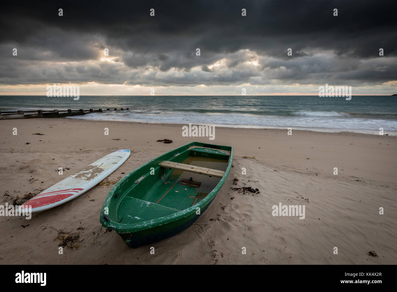 dramatic sky on beach at sunrise Stock Photo