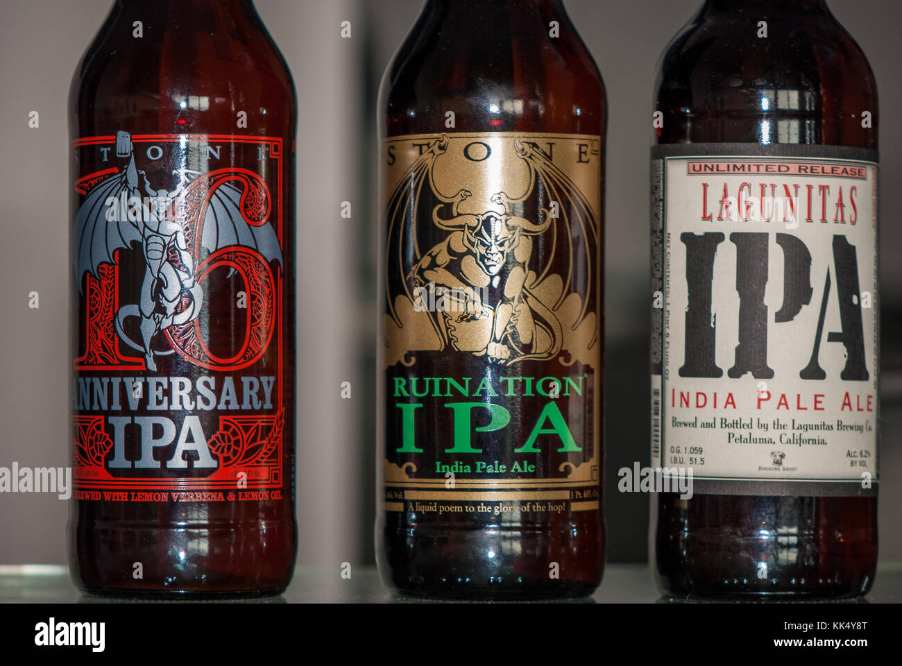 american IPA beer bottles, stone 16th aniversary IPA, Ruination IPA and Lagunitas IPA Stock Photo