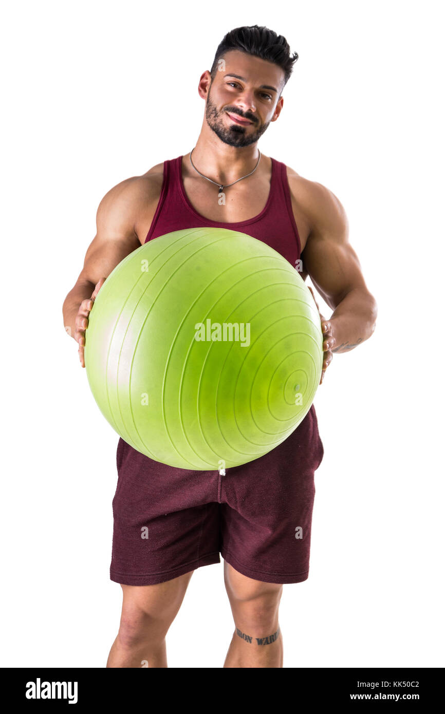 Muscular man holding inflatable fitness ball, looking at camera, standing  isolated on white background Stock Photo - Alamy