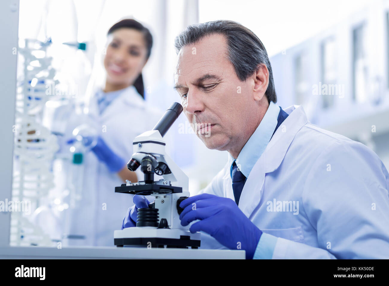 Serious adult man focusing on his work Stock Photo