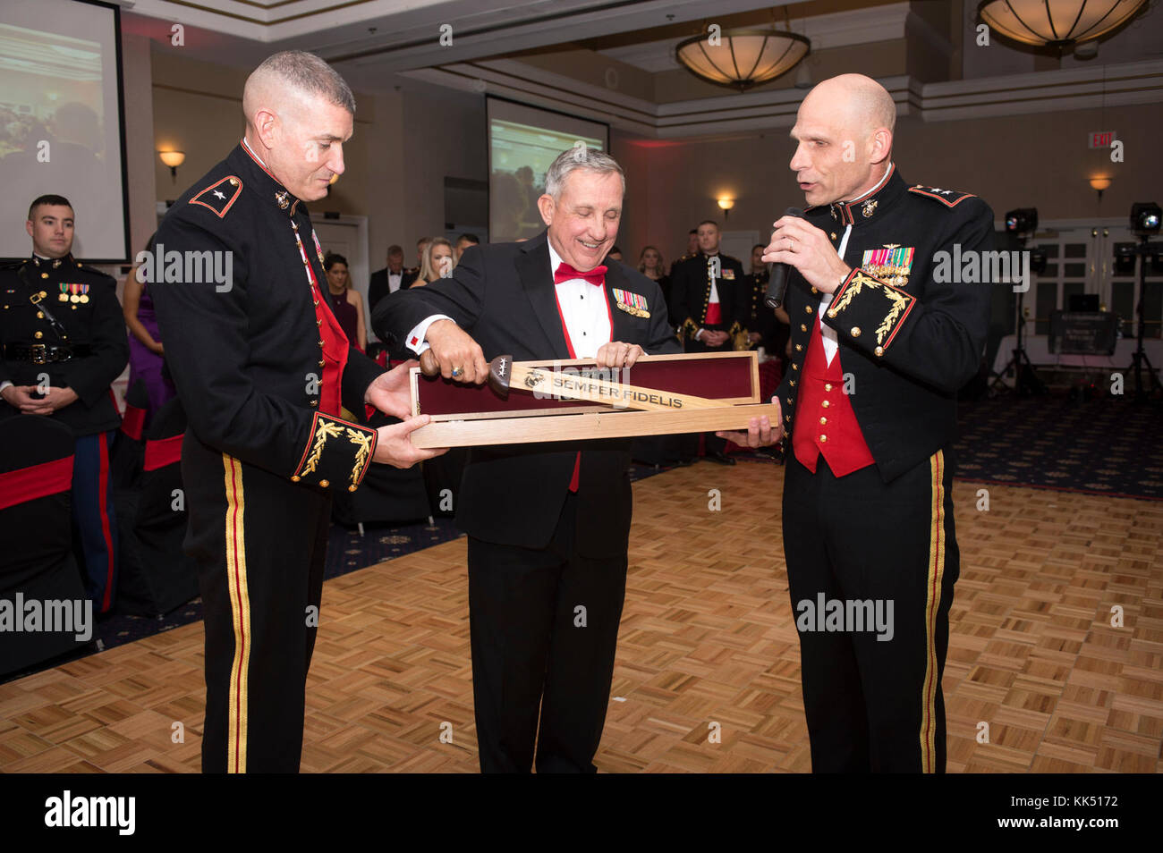 Retired U.S. Marine Corps Lt. Gen. George Flynn, center, guest of honor ...