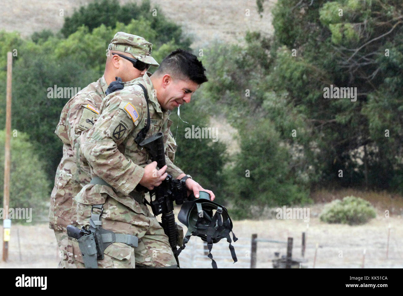 Spc. David Enriquez-Ortiz “releases” after exiting a gas chamber Nov. 8 during the California Army National Guard's 2017-18 Best Warrior Competition at Camp San Luis Obispo, California. This was one of the last tests after four competitive days to find California’s Best of the Bests. (Army National Guard photo by Staff Sgt. Eddie Siguenza) Stock Photo