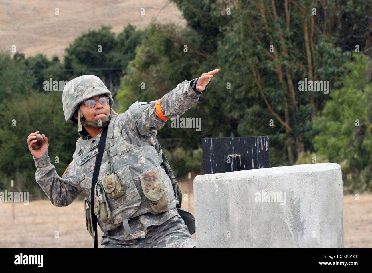 Spc. Emefa Freckleton prepares to throw a grenade simulator Nov. 8 during the California Army National Guard's 2017-18 Best Warrior Competition at Camp San Luis Obispo, California. This was one of the last tests after four competitive days to find California’s Best of the Best. (Army National Guard photo by Staff Sgt. Eddie Siguenza) Stock Photo