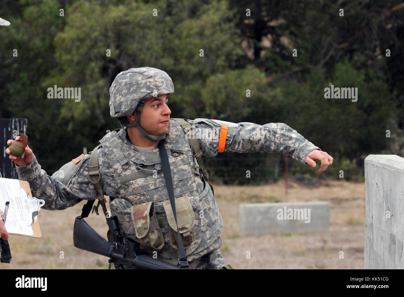 Spc. Fabio Avetisyan prepares to throw a grenade simulator Nov. 8 during the California Army National Guard's 2017-18 Best Warrior Competition at Camp San Luis Obispo, California. This was one of the last tests after four competitive days to find California’s Best of the Best. (Army National Guard photo by Staff Sgt. Eddie Siguenza) Stock Photo