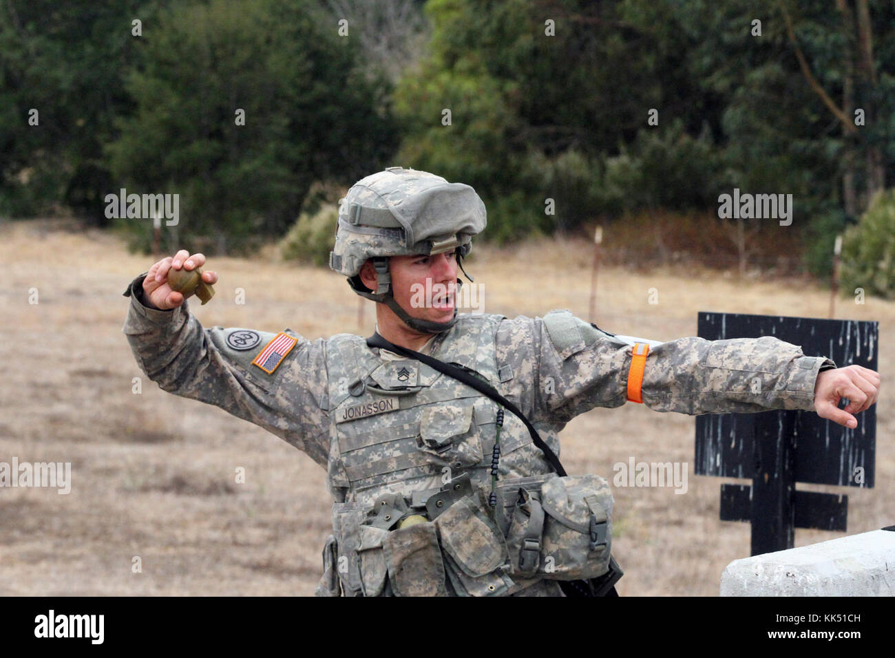 Staff Sgt. Jared Jonasson prepares to throw a grenade simulator Nov. 8 during the California Army National Guard's 2017-18 Best Warrior Competition at Camp San Luis Obispo, California. This was one of the last tests after four competitive days to find California’s Best of the Best. (Army National Guard photo by Staff Sgt. Eddie Siguenza) Stock Photo