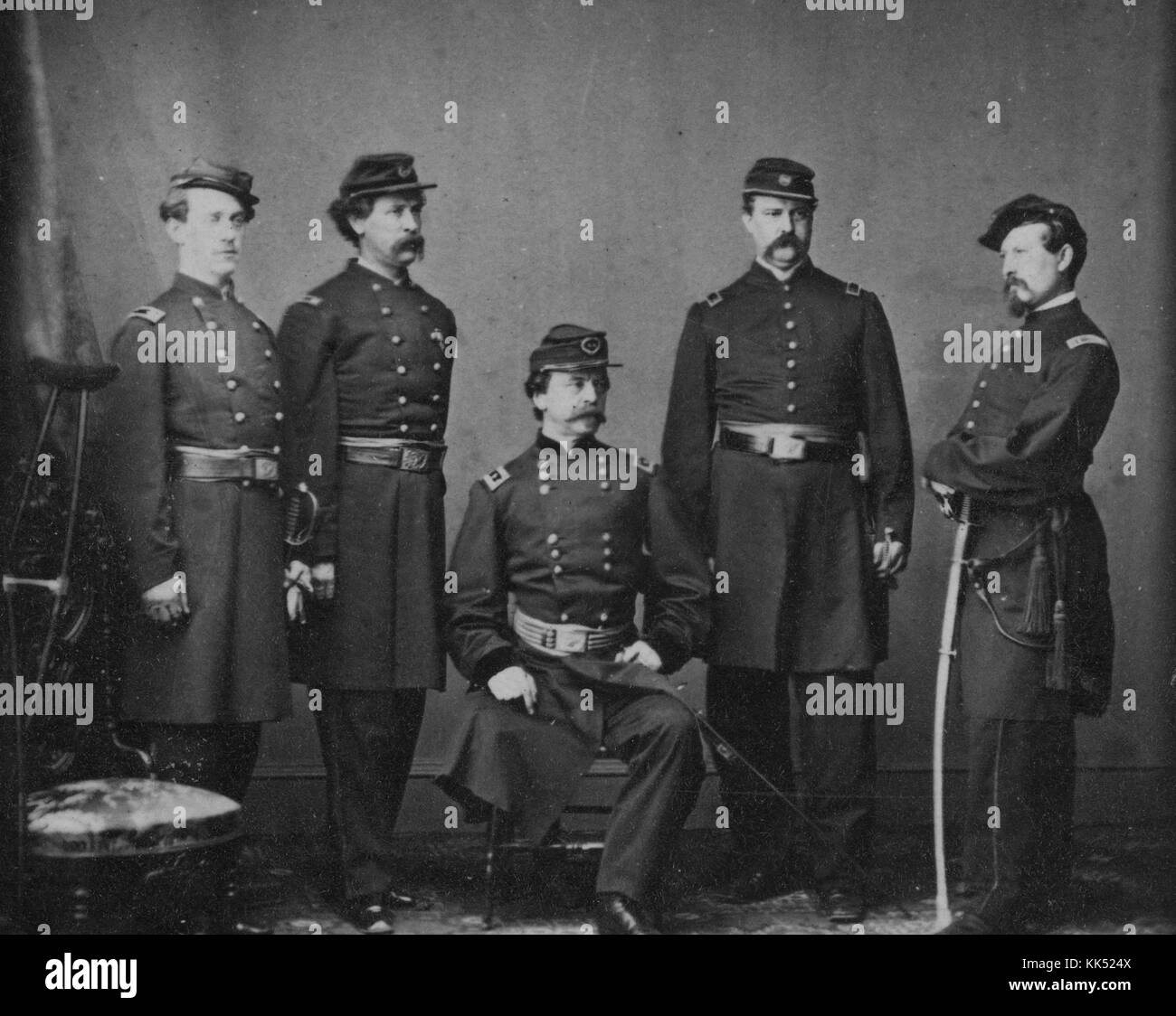 Photograph of General Daniel E Sickles, sitting, American politician, soldier, and diplomat, acquitted of killing his wife's lover after using temporary insanity as a legal defense for the first time in United States history, surrounded by his staff, 1860. From the New York Public Library. Stock Photo