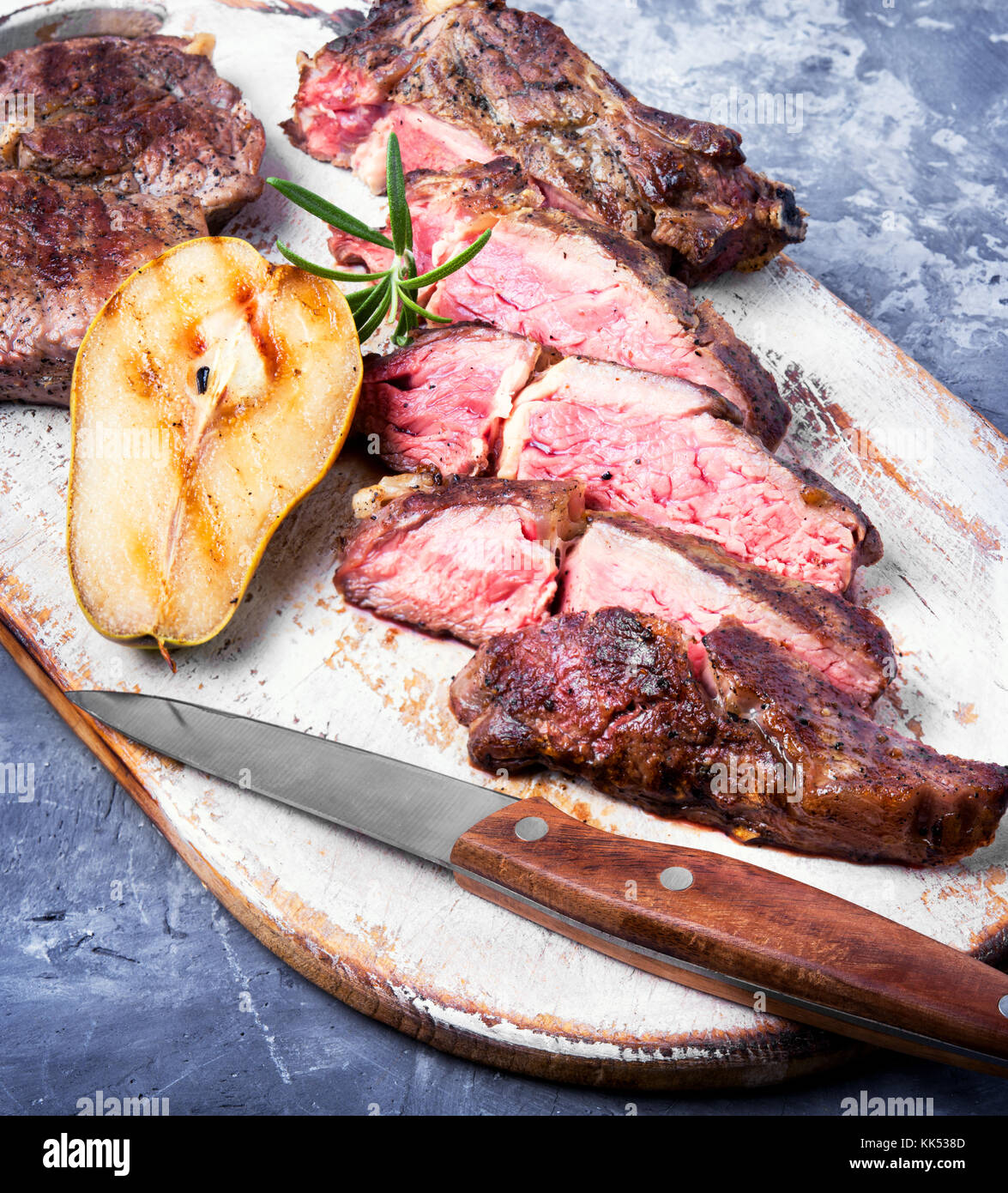 cut into layers of meat veal steak with pear sauce Stock Photo Alamy