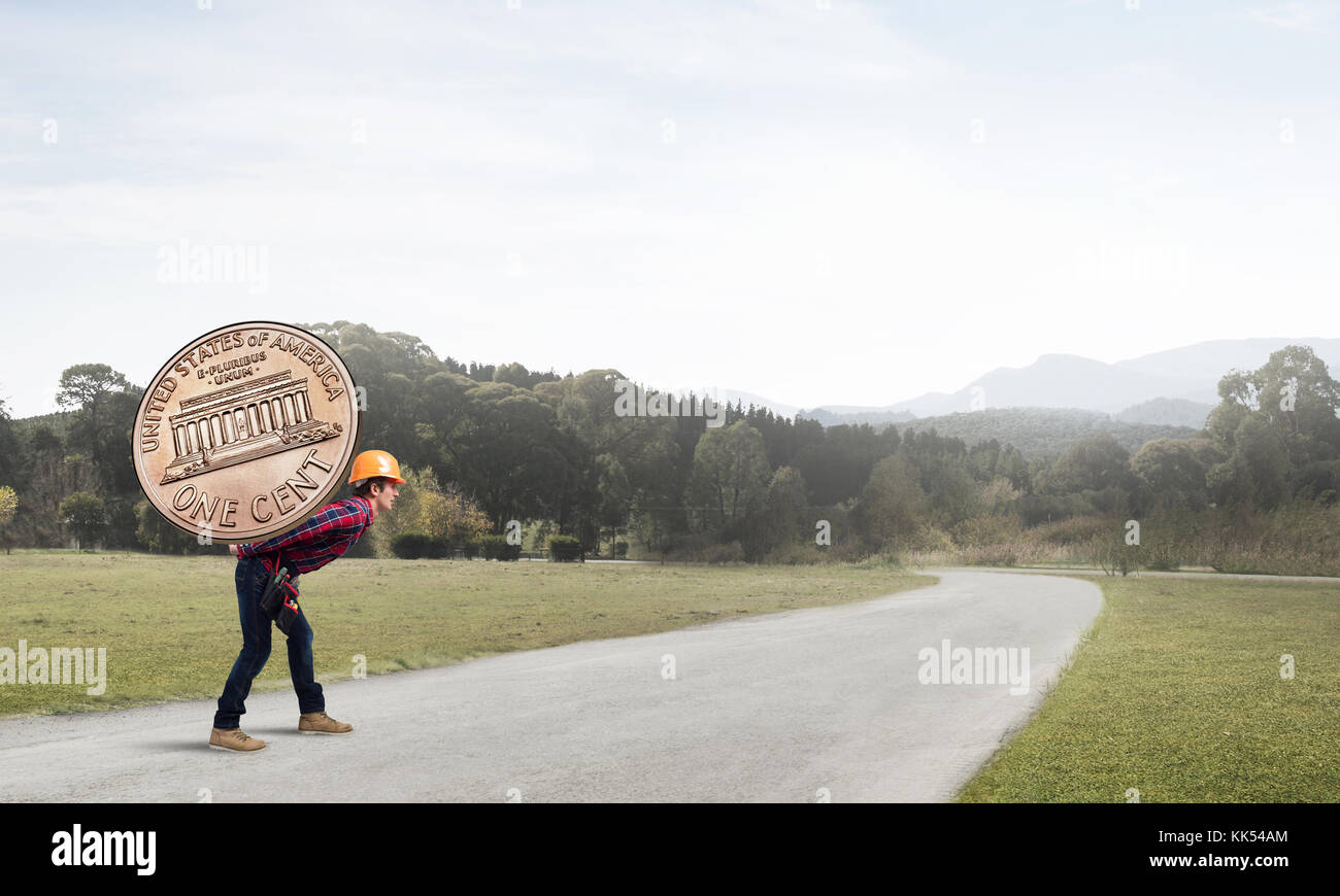 Builder man carry coin Stock Photo Alamy
