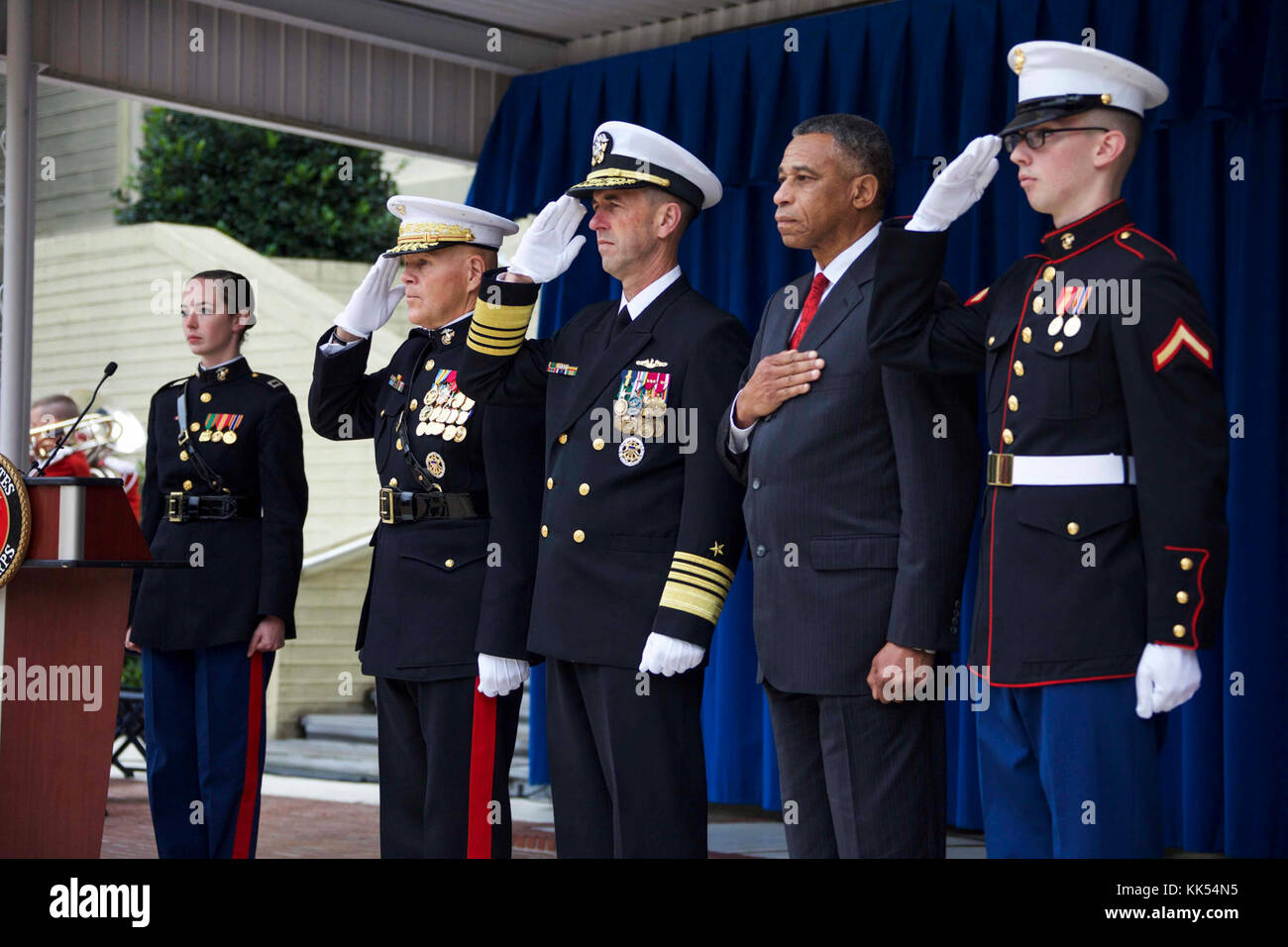 Distinguished guests render honors during the presentation of colors at ...
