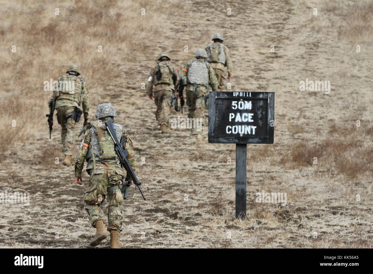 Competitors in the California Army National Guard's 2017-18 Best Warrior Competition get their pace count before the land navigation test at Camp San Luis Obispo, California. (Army National Guard photo by Staff Sgt. Eddie Siguenza) Stock Photo