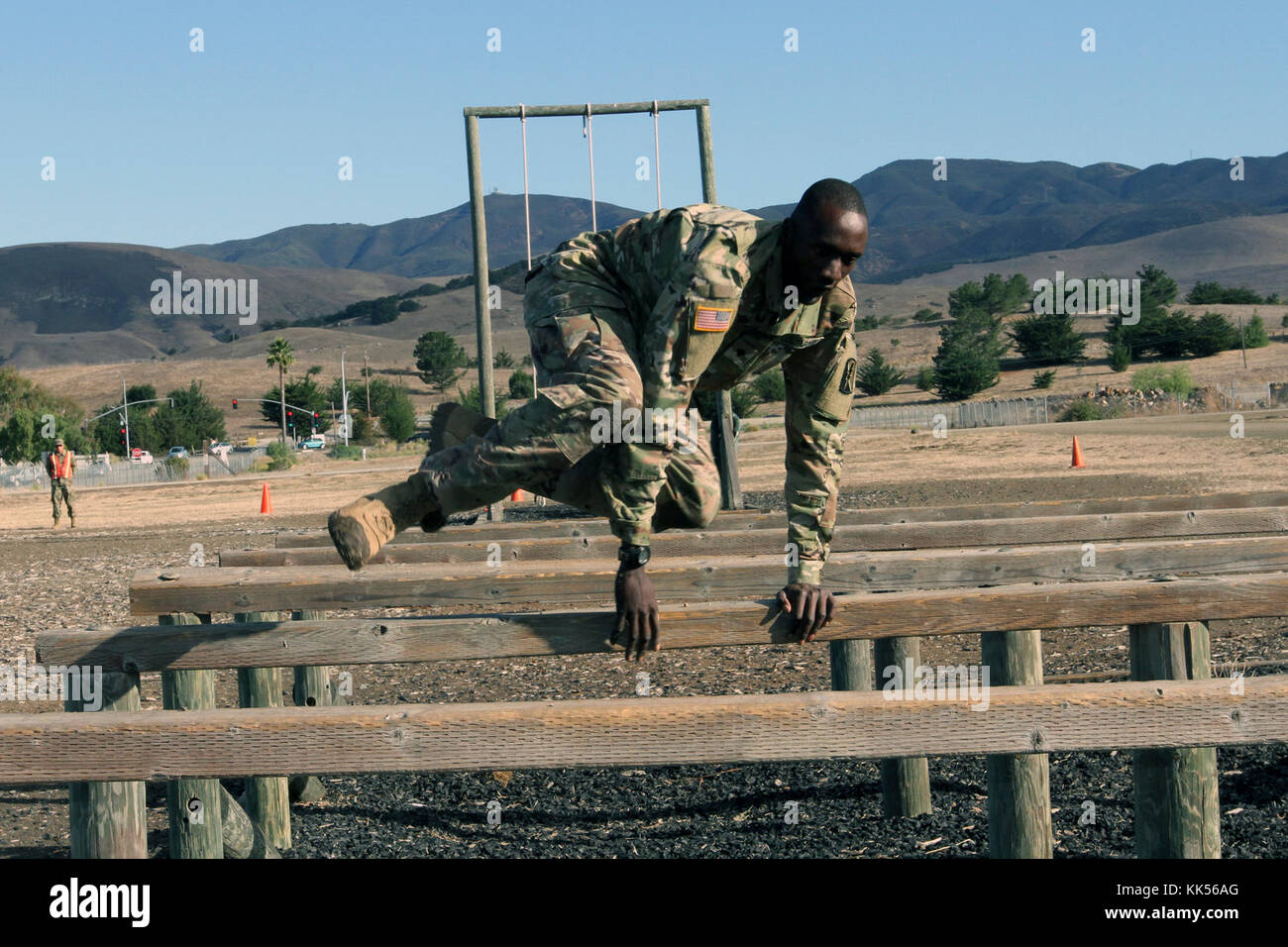 Spc. Deng A. Deng hurdles an obstacle during Day 3 of a four-day Best Warrior Competition by the California Army National Guard at Camp San Luis Obispo, California. (Army National Guard photo by Staff Sgt. Eddie Siguenza) Stock Photo