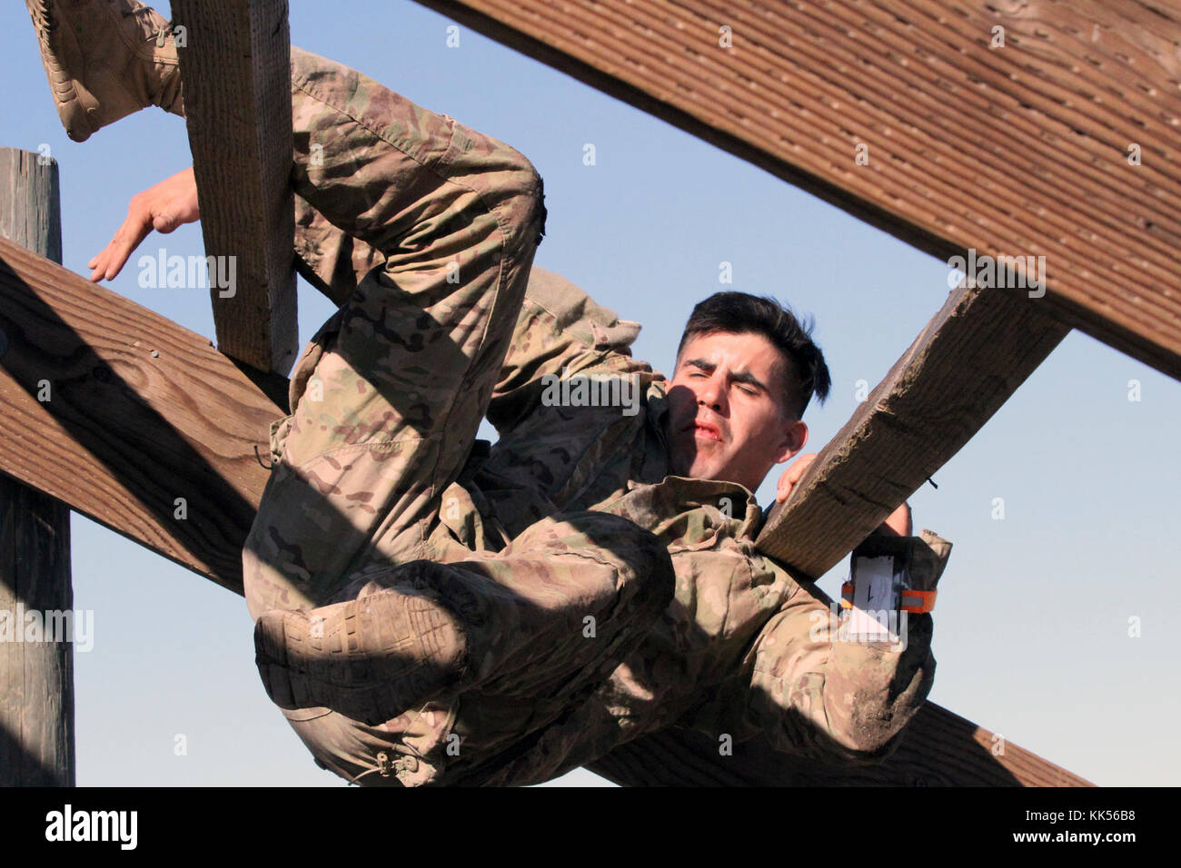 Spc. David Enriquez-Ortiz works his way through The Weave, an overhead challenge in the obstacle course of the California Army National Guard's 2017-18 Best Warrior Competition at Camp San Luis Obispo, California. (Army National Guard photo by Staff Sgt. Eddie Siguenza) Stock Photo