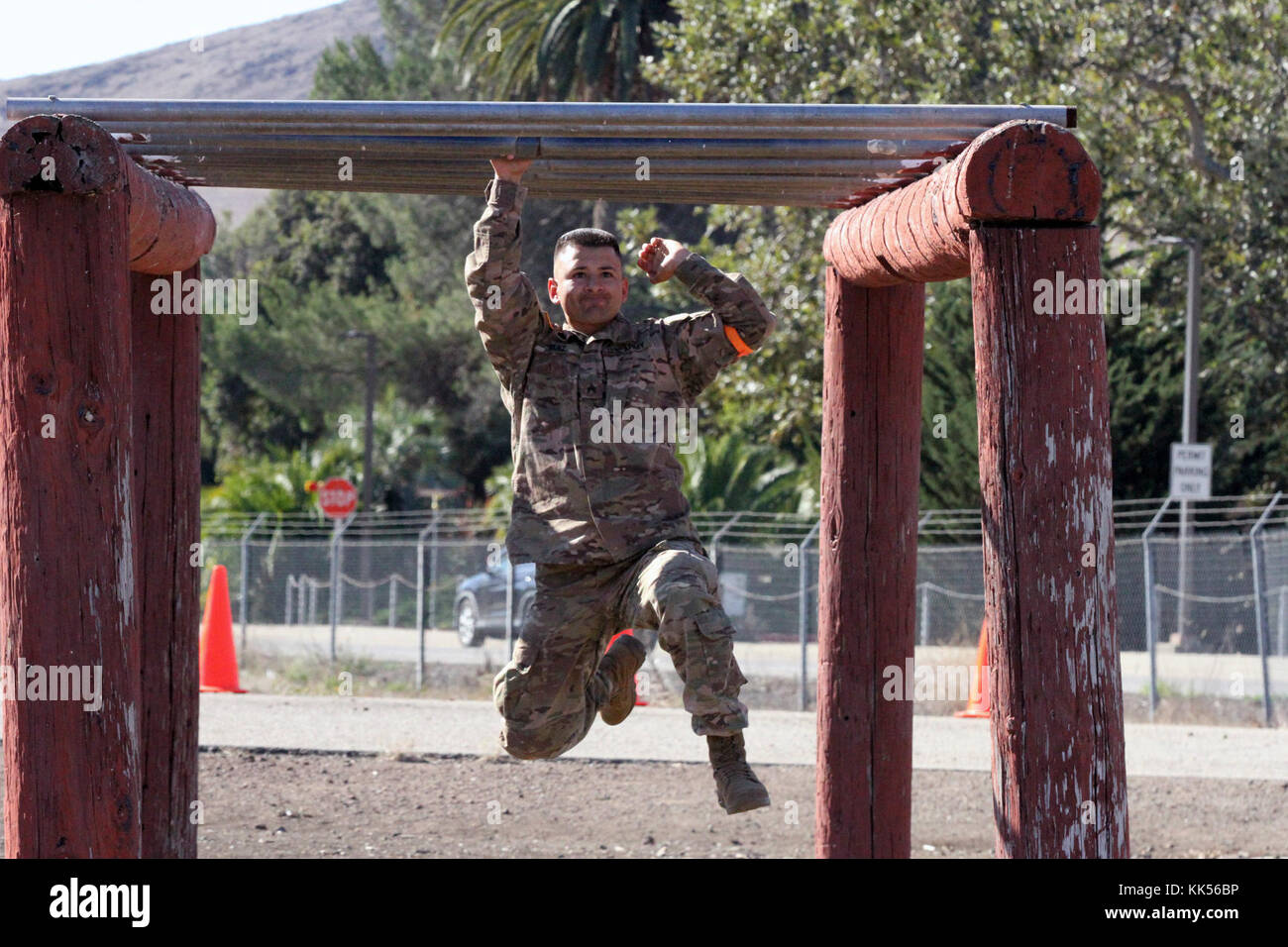 Sgt. George Ruiz works his way through the monkey bars in the obstacle course of the California Army National Guard's 2017-18 Best Warrior Competition at Camp San Luis Obispo, California. (Army National Guard photo by Staff Sgt. Eddie Siguenza) Stock Photo