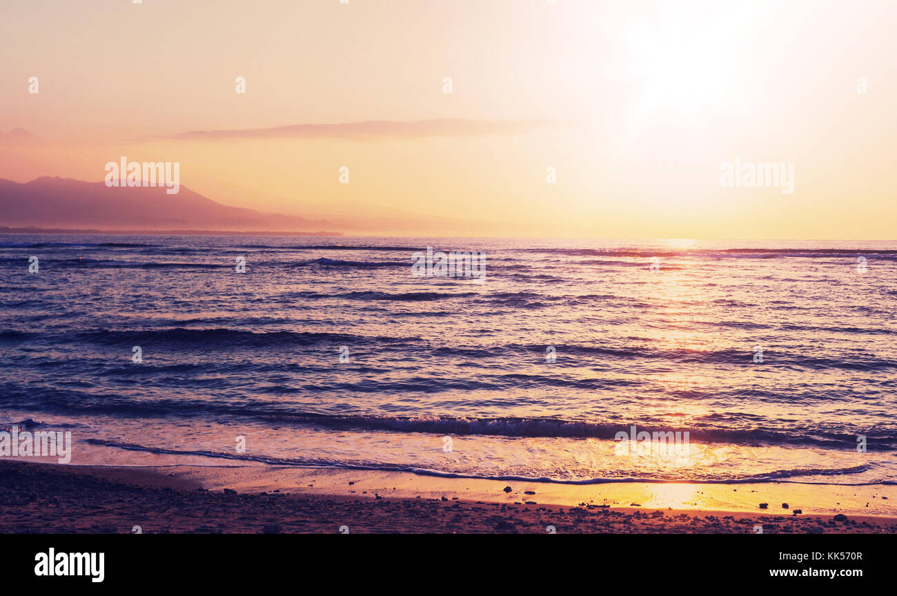 Scenic sunset at the sea coast Stock Photo - Alamy