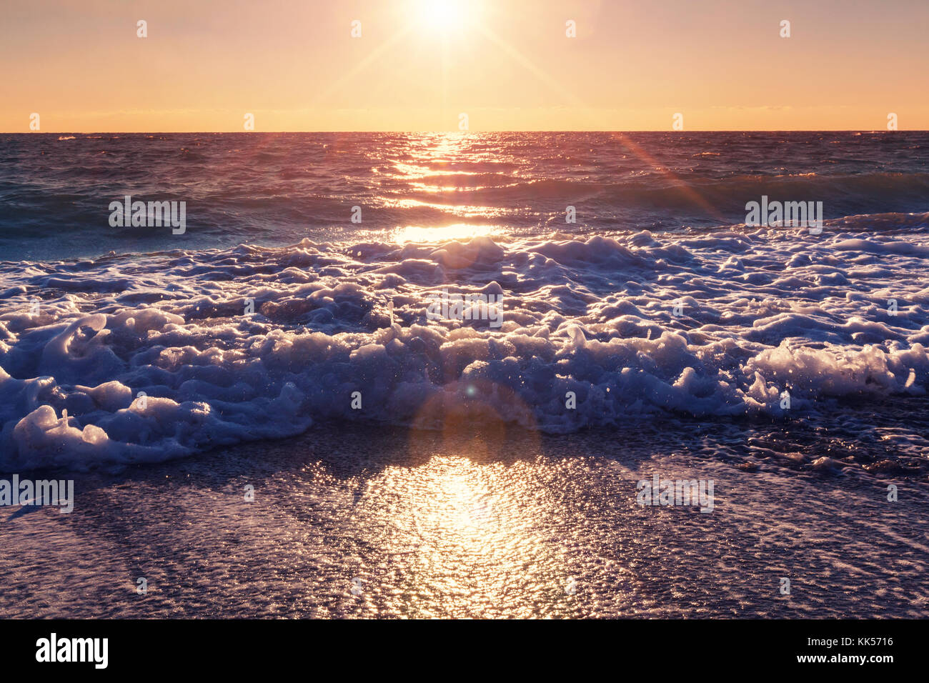 Scenic sunset at the sea coast Stock Photo - Alamy