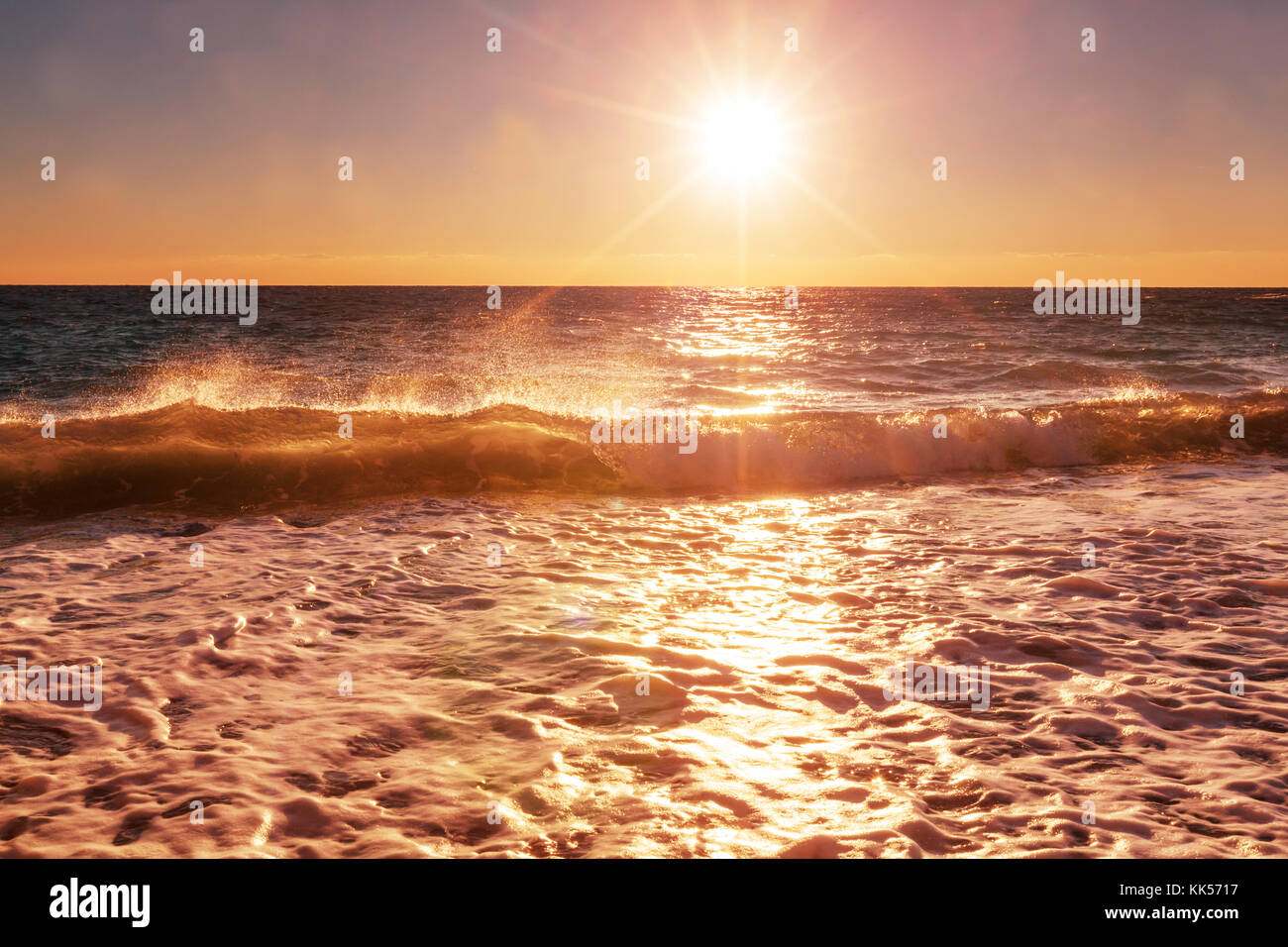 Scenic sunset at the sea coast Stock Photo - Alamy
