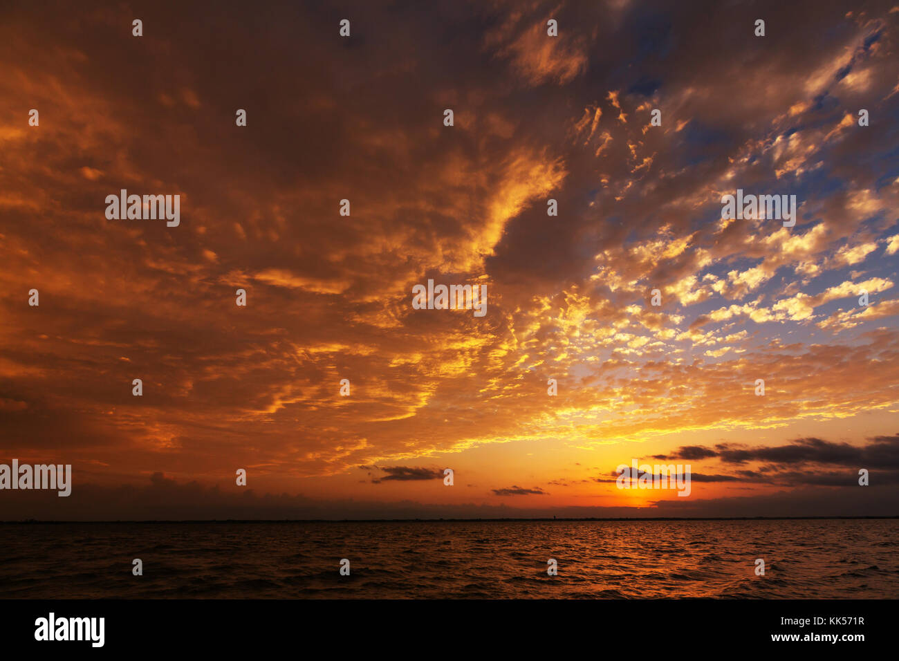 Scenic sunset at the sea coast Stock Photo - Alamy