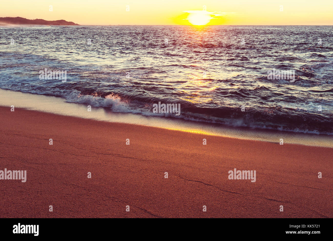 Scenic sunset at the sea coast Stock Photo - Alamy