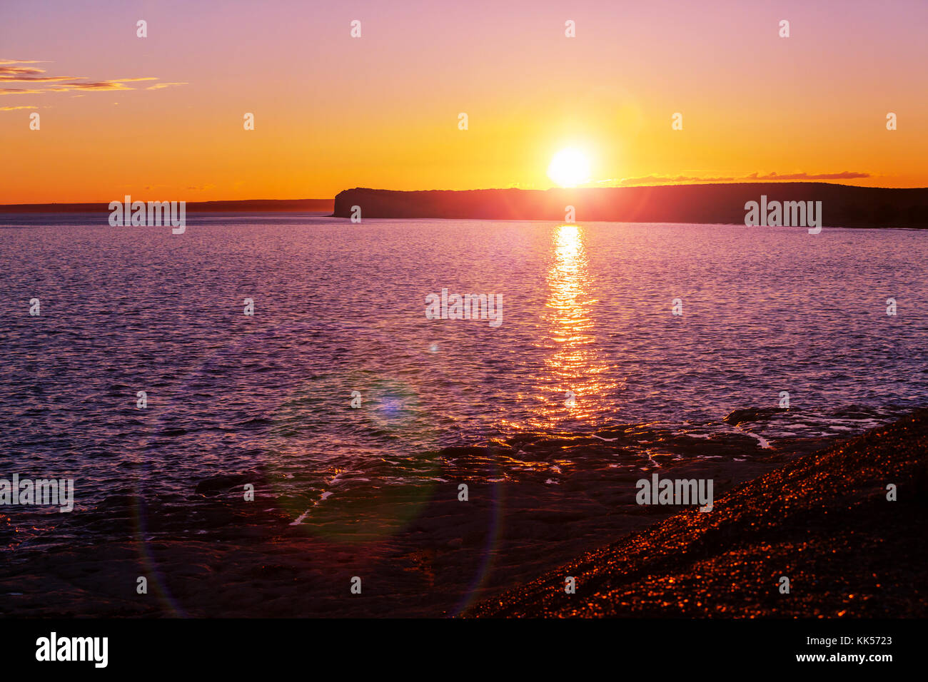 Scenic sunset at the sea coast Stock Photo - Alamy