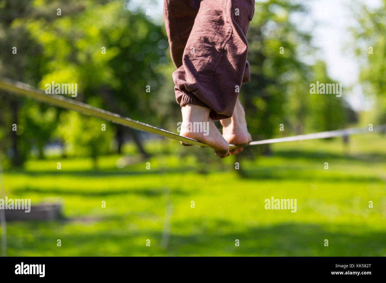 Slacklining is a practice in balance Stock Photo Alamy