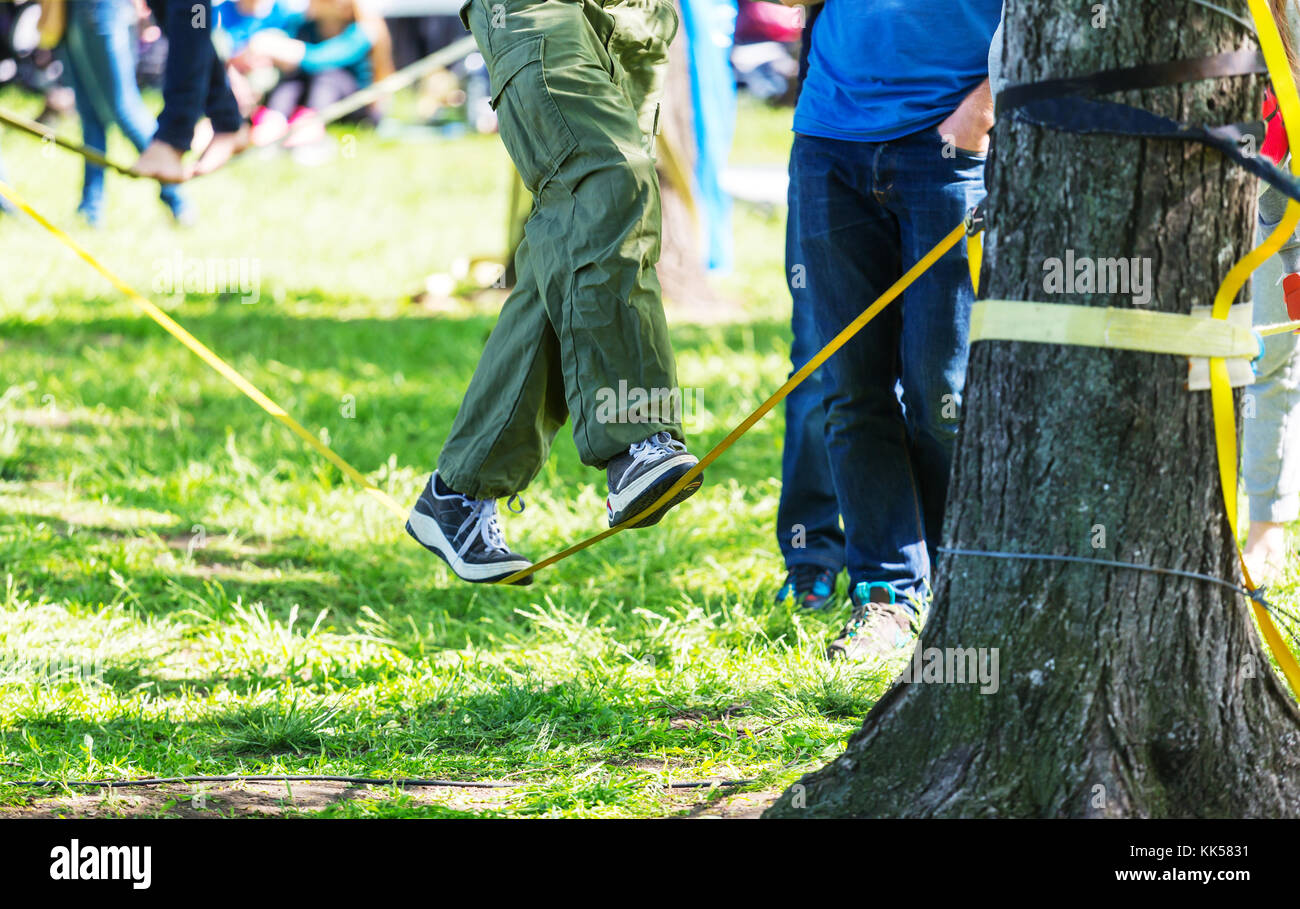 Slacklining is a practice in balance Stock Photo - Alamy