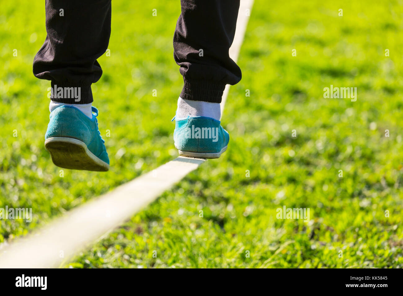 Slacklining is a practice in balance Stock Photo - Alamy