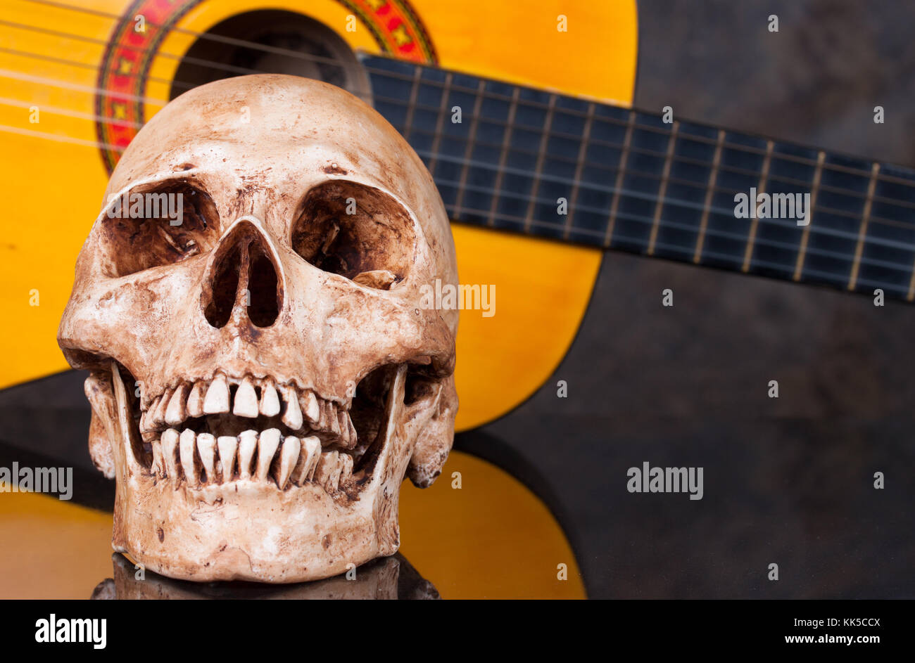 Head skull with  classical guitar Stock Photo