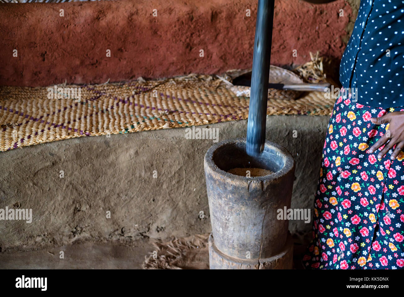 Closseup Indian woman works with mortar and pestle Stock Photo