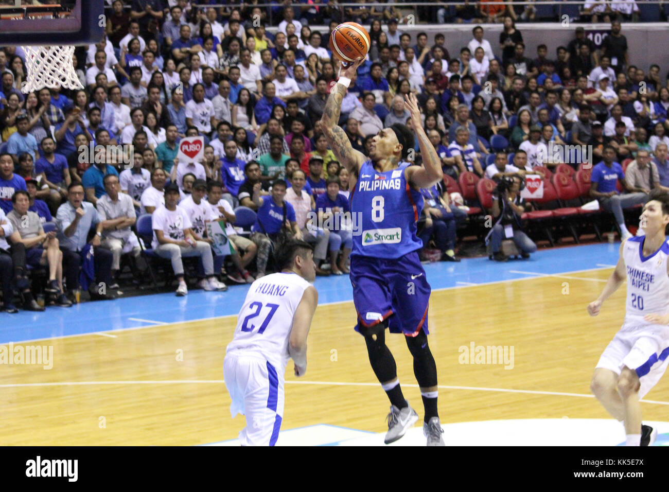 Quezon City, Philippines. 27th Nov, 2017. Calvin Abueva (8) of the Philippines soars over Jhen Huang (27) from Chinese Taipei to convert an uncontested lay-up during their FIBA World Cup Qualifying Match. Gilas Pilipinas defeated the visiting Chinese Taipei team 90-83 to complete a sweep of their first two assignments in the FIBA 2019 World Cup qualifiers. Credit: Dennis Jerome Acosta/ Pacific Press/Alamy Live News Stock Photo