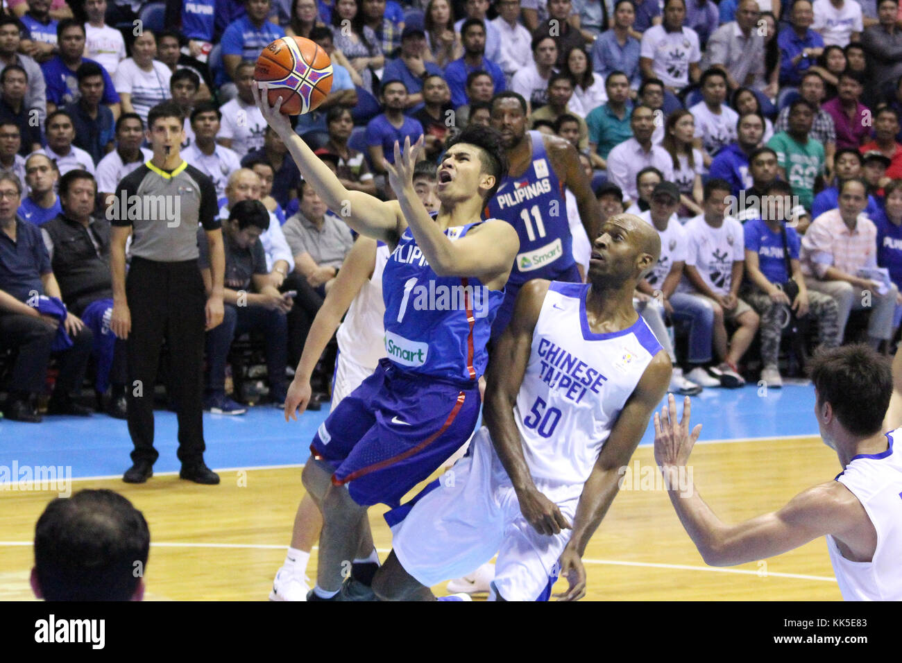 Quezon City, Philippines. 27th Nov, 2017. Kiefer Isaac Ravena (1) of the Philippines drives past two players from soars past Quincy Davis III (50) of Chinese Taipei to convert an uncontested lay-up during their FIBA World Cup Qualifying Match. Gilas Pilipinas defeated the visiting Chinese Taipei team 90-83 to complete a sweep of their first two assignments in the FIBA 2019 World Cup qualifiers. Credit: Dennis Jerome Acosta/ Pacific Press/Alamy Live News Stock Photo