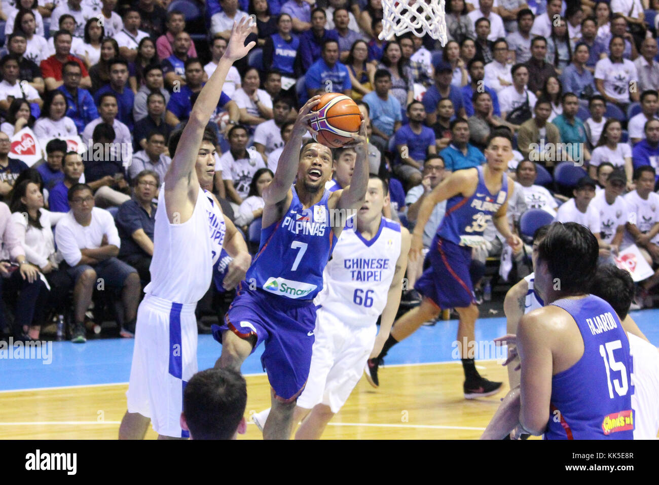 Quezon City, Philippines. 27th Nov, 2017. Jayson Castro William (7) of the Philippines drives past several players from Chinese Taipei to convert an uncontested lay-up during their FIBA World Cup Qualifying Match. Gilas Pilipinas defeated the visiting Chinese Taipei team 90-83 to complete a sweep of their first two assignments in the FIBA 2019 World Cup qualifiers. Credit: Dennis Jerome Acosta/ Pacific Press/Alamy Live News Stock Photo