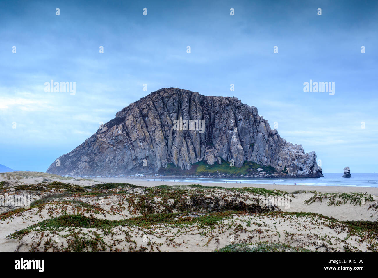 Morro Rock with Sandy Dunes of Morro Creek Beach. Stock Photo