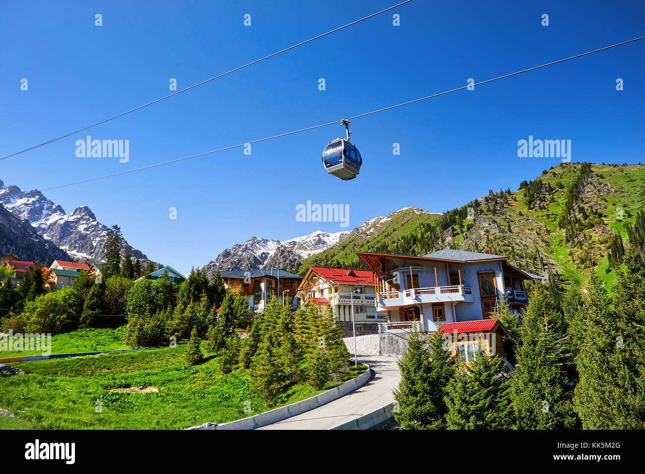 Cable car and cottages in the mountain ski resort Chimbylak in Almaty, Kazakhstan Stock Photo