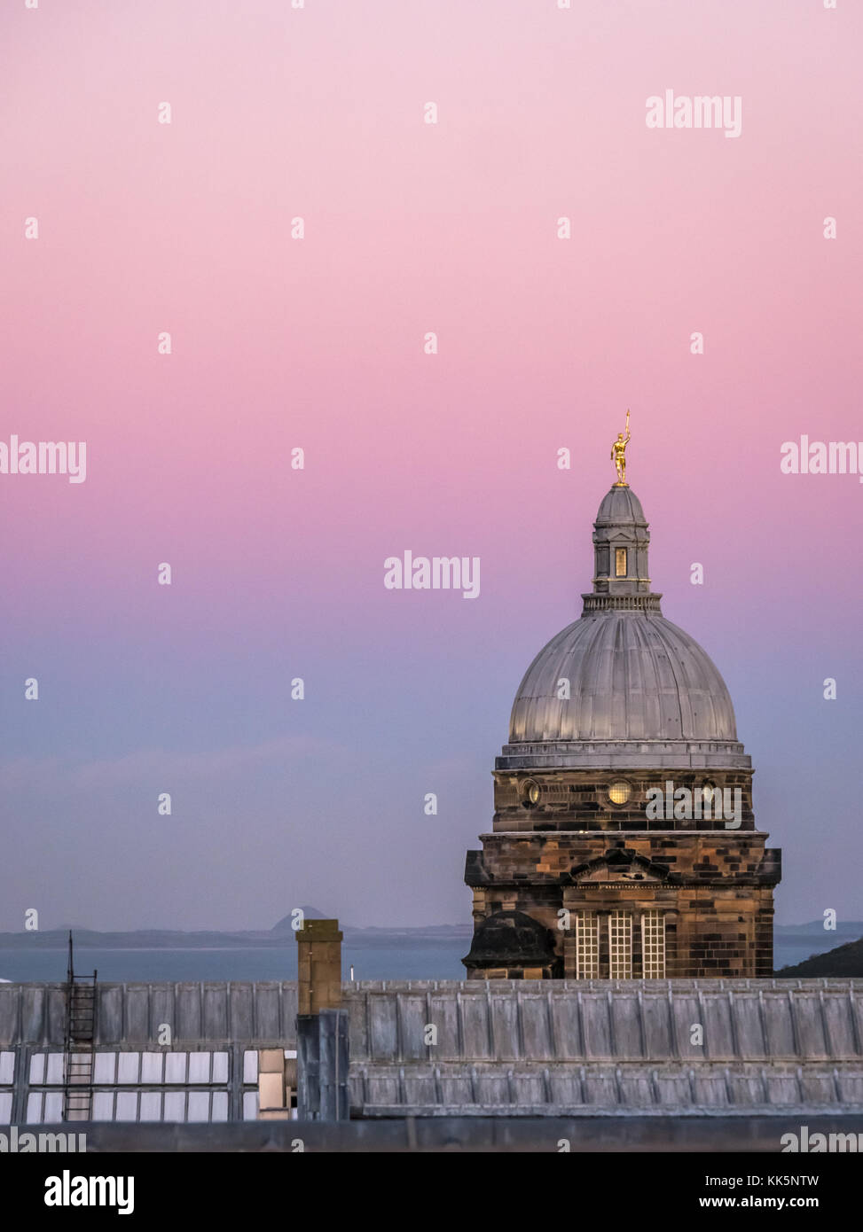 Sunset view of rooftop skyline, Old College dome, University of Edinburgh, Edinburgh, Scotland, UK, with pink sky sunset Stock Photo