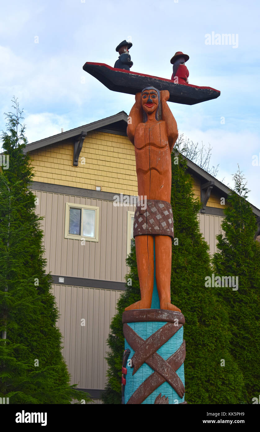 The House of Tears Carvers of the Lummi Nation created these totem poles. The Story of Salmon Woman and Her Children - Stock Photo
